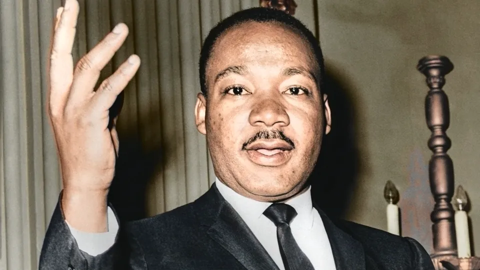 Martin Luther King Jr. in 1964, mid-gesture as he speaks (colorized).